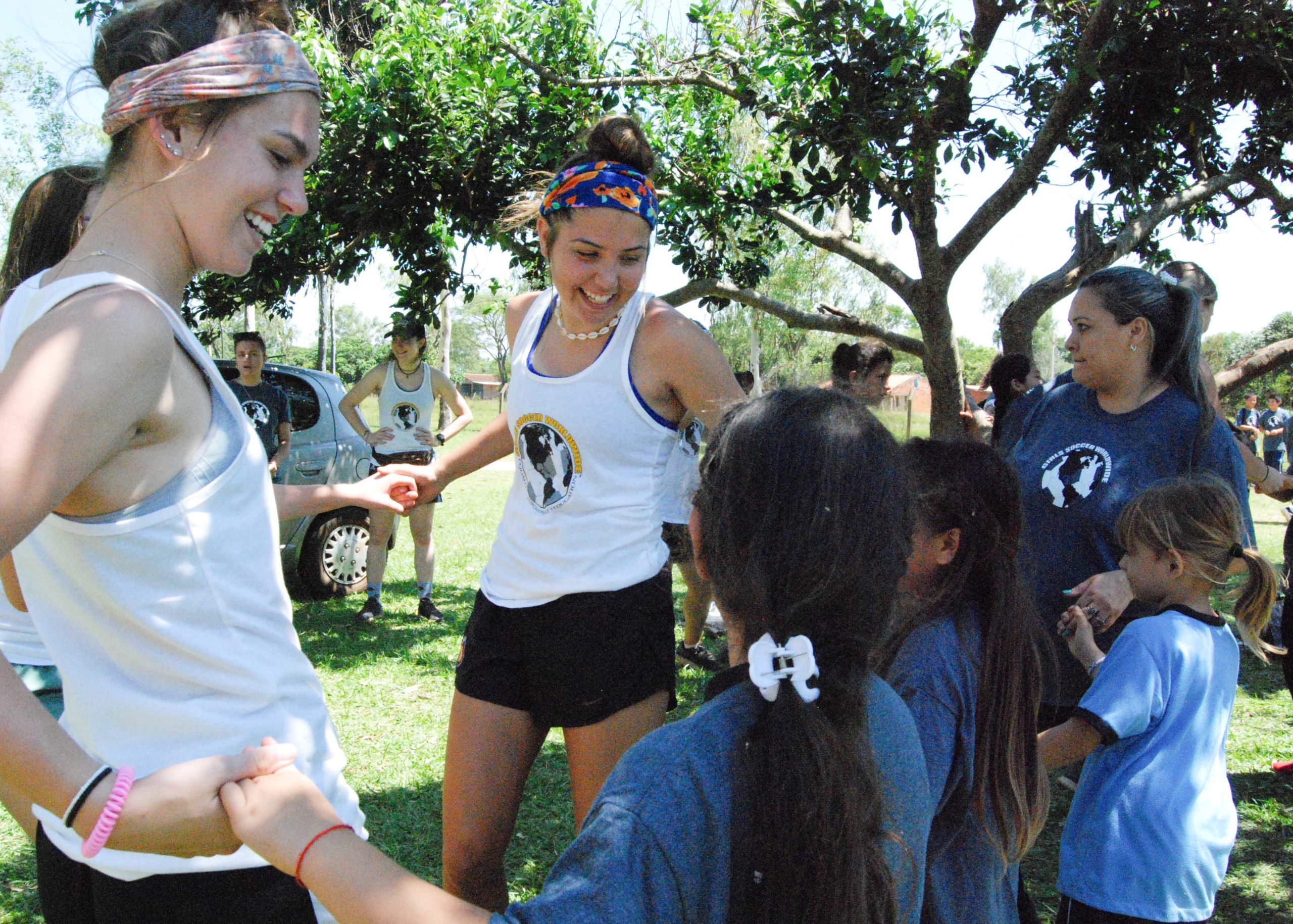 Emily with Girls Soccer Worldwide Ambassador Megan Guerra, bonding with young girls in Paraguay.